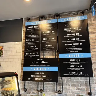 menus on a brick wall