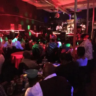 a crowd of people sitting at tables