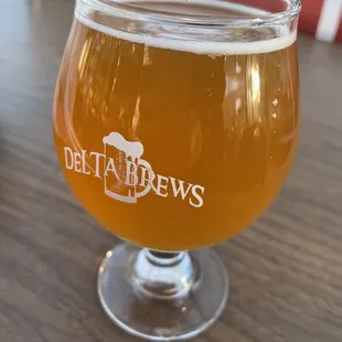 a glass of beer on a table