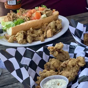 Oyster po boy w/ fried artichokes and the side of the day / fried oysters