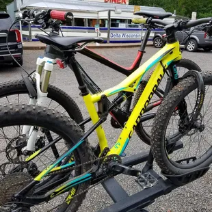 a bicycle on a rack in a parking lot