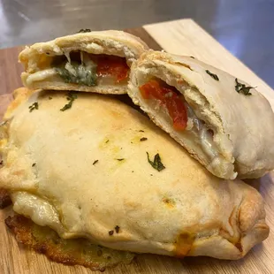 The new Vine ripened Delta tomatoes, fresh mozzarella cheese, and basil chiffonade Hand Pie