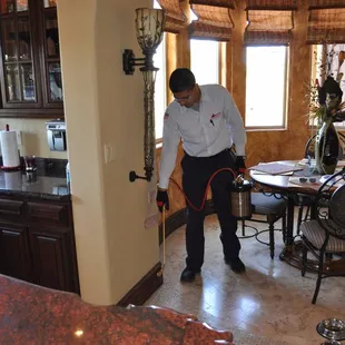 a man using a vacuum