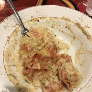 a plate of food with a fork in it