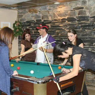 "The Black Widow," Hall of  famer is giving an autograph writing on a pool table...one of many celebrities that have attended the restaurant