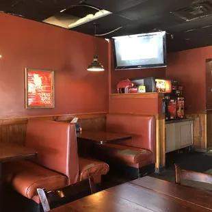 The seat cushions in the booths need to be replaced.