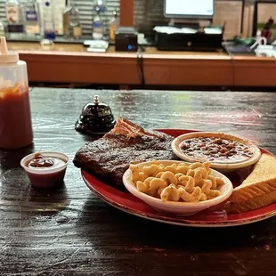 St. Louis style rib dinner plate. With side of Delta Q Baked Beans and Mac &amp; Cheese.  Bbq sauce on the side.