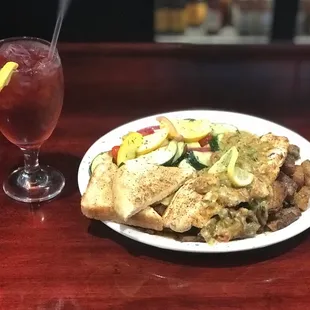 Red fish grilled over a wood fire, topped with our bourbon crawfish sauce!