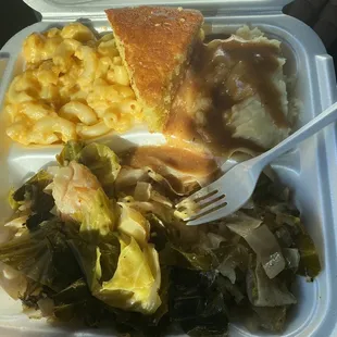 a styrofoam container of food