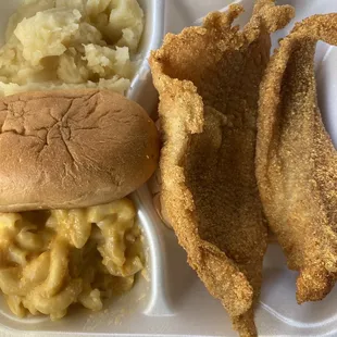 a chicken sandwich, macaroni and cheese, and fried fish