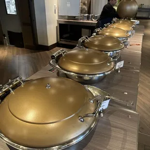 Hot bar. Biscuits. Gravy. Grits. Potatoes. Eggs. Sausage.