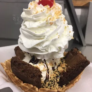 Hard vanilla brownie sundae with whip, nuts and cherry