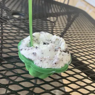 an ice cream with a green candle