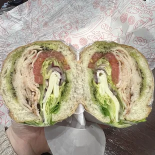 South Boston sandwich with lettuce, tomato, red onions, pesto on a sub roll