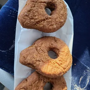 three doughnuts in a paper wrapper