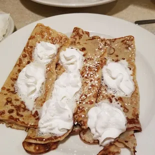 Crepes with butter and whipped cream