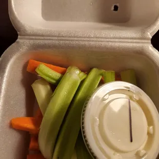 Side veggies yes this what they are referring to celery and carrot sticks. There is an extra charge for additional dressing.