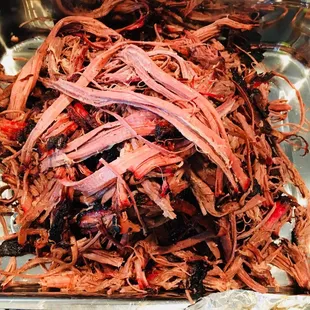 ows shredded meat in a pan
