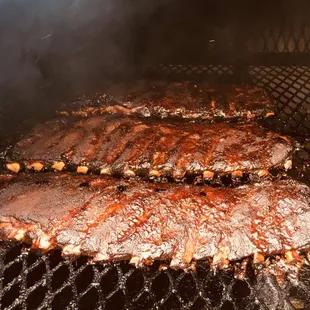 ows ribs cooking on a grill