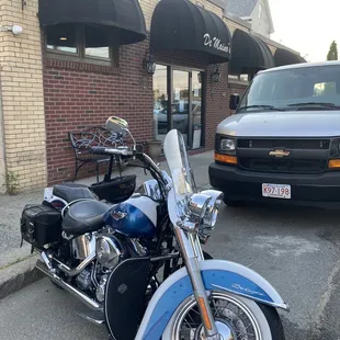 a motorcycle parked in front of the restaurant