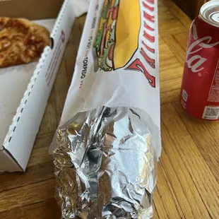 a hot dog and a can of soda