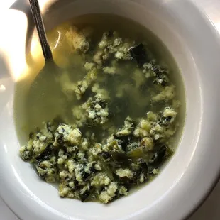 a bowl of soup with a spoon