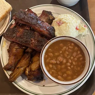 Ribs, smoked chicken wings, bbq baked beans, potato salad