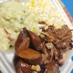 3 meat plate = pulled pork, beef brisket, sausage.  2 sides = jalapeno corn &amp; potato salad