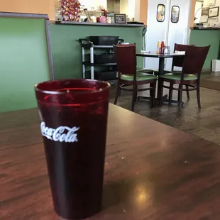 a red cup on a table in a restaurant