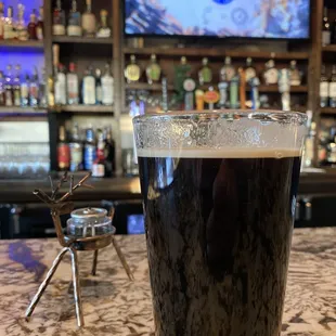 a pint of dark beer