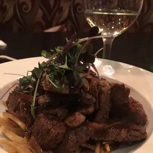 Steak with mushrooms.