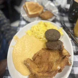 Cheese grits, fried flounder, sausage, eggs, toast