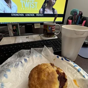 Bacon, fried egg and cheese biscuit with fresh coffee