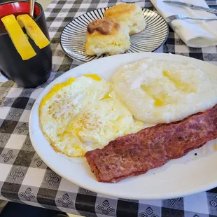 2 eggs over medium with turkey bacon , grits and biscuits. All served with hit tea, honey and !  Loved it! Tasted like love!