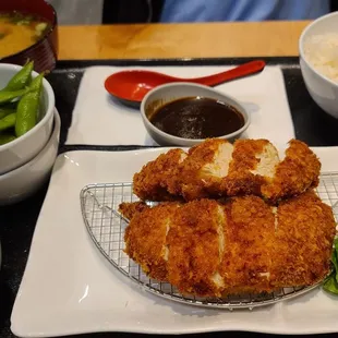  plate of fried chicken and a bowl of rice