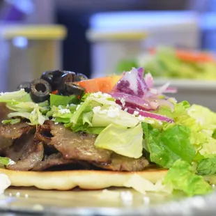 a pita sandwich with meat and vegetables