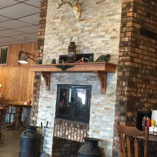 Beautiful fireplace and dining room.