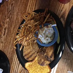 Grilled chicken breast with fries.