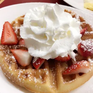 Waffle with fresh whip and Strawberries..