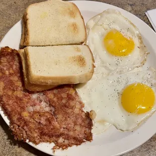 Corned beef hash with 2 sunny side up eggs