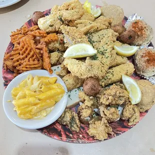 Seafood platter for two with mac and cheese and sweet potato fries.