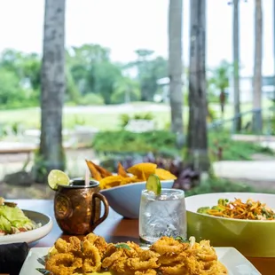 a plate of fried food and a bowl of salad