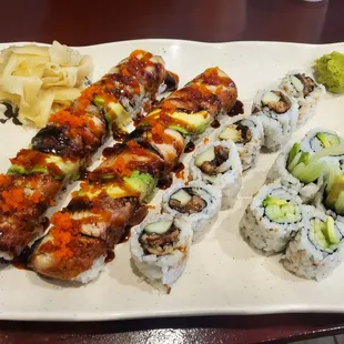 Two Dragon Maki, one unagi maki, and one cucumber and avocado maki.