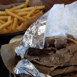 a sandwich and french fries on a table