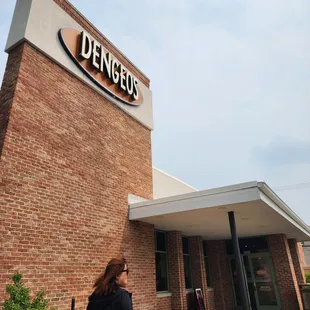 a woman walking in front of a store