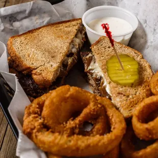 a sandwich and onion rings