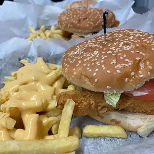 Fried catfish sandwich with cheese fries.