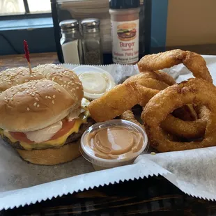 Small 5 oz (over quarter lbs) cheeseburger with side of onion rings and our new house chipotle sauce.