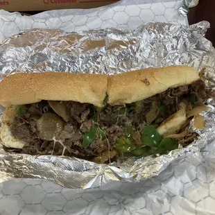Cheesesteak with onions and peppers.