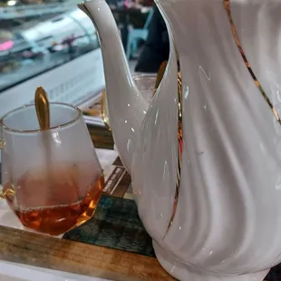 Pot of tea . Excellent choice